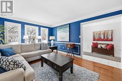 Formal Living Room with Hardwood Flooring - 