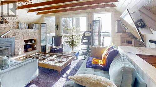 8 Fr 62 Street, Trent Lakes, ON - Indoor Photo Showing Living Room With Fireplace