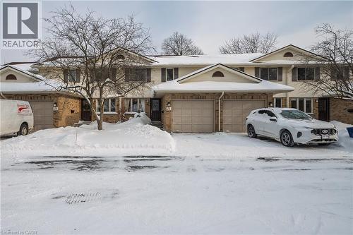 View of front of home and attached garage - 375 Kingscourt Drive Unit# 21, Waterloo, ON - Outdoor With Facade