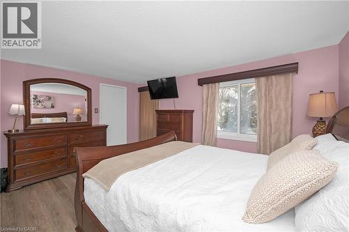 Bedroom with wood finished floors and baseboards - 375 Kingscourt Drive Unit# 21, Waterloo, ON - Indoor Photo Showing Bedroom