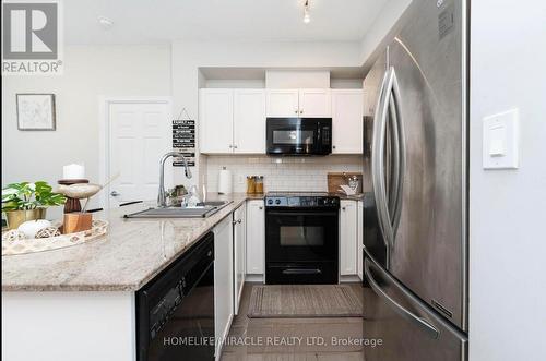 1702 - 3504 Hurontario Street, Mississauga, ON - Indoor Photo Showing Kitchen With Upgraded Kitchen