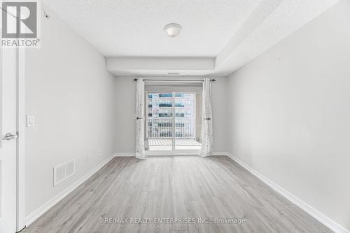 Primary Bedroom is large with walkout to balcony - 1420 - 8 Dayspring Circle, Brampton, ON - Indoor Photo Showing Other Room
