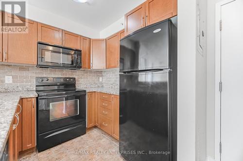 Kitchen with Ample Storage and Counter Space - 1420 - 8 Dayspring Circle, Brampton, ON - Indoor Photo Showing Kitchen