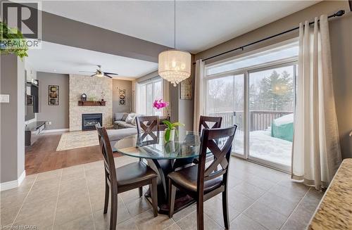 928 Evens Pond Court, Kitchener, ON - Indoor Photo Showing Dining Room With Fireplace