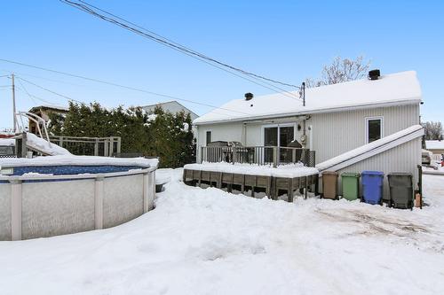 Back facade - 518 Rue Rabelais, Saguenay (Chicoutimi), QC - Outdoor With Above Ground Pool With Deck Patio Veranda