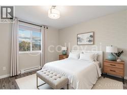 VIRTUALLY STAGED PHOTO- bedroom - 