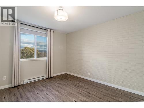 King sized Primary bedroom - 1915 Pacific Court Unit# 407, Kelowna, BC - Indoor Photo Showing Other Room