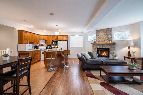 2102 Lillooet Court, Kelowna, BC - Indoor Photo Showing Living Room With Fireplace