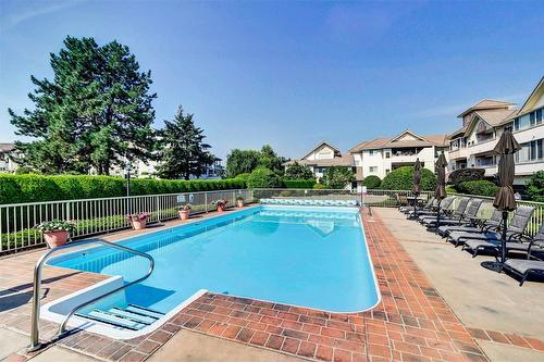 102-2300 Benvoulin Road, Kelowna, BC - Outdoor With In Ground Pool