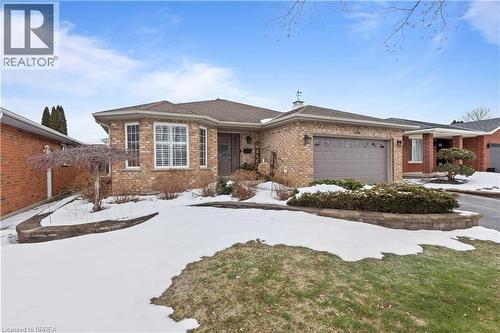 Welcome To This Stunning All Brick Bungalow in a desirable family friendly quiet neighborhood - 12 Falls Crescent, Simcoe, ON - Outdoor With Facade