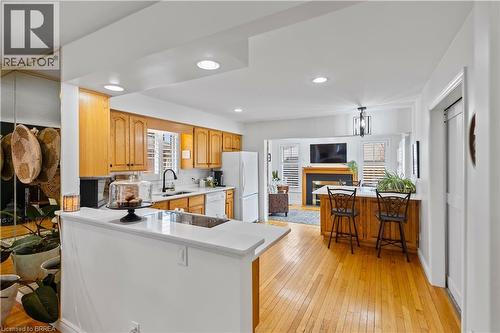 Beautiful quartz countertops flow throughout your open concept kitchen - 12 Falls Crescent, Simcoe, ON - Indoor Photo Showing Kitchen