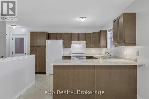 725 Binning Street W, North Perth (Listowel), ON - Indoor Photo Showing Kitchen With Double Sink