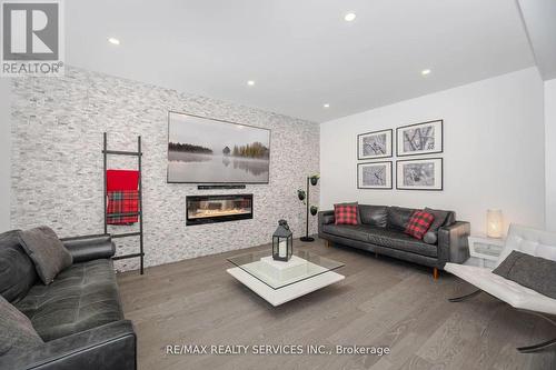 112 Newhouse Boulevard, Caledon, ON - Indoor Photo Showing Living Room With Fireplace