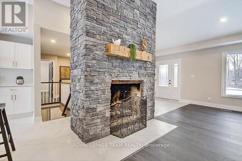 6636 Marina Drive, Ottawa, ON - Indoor Photo Showing Living Room With Fireplace