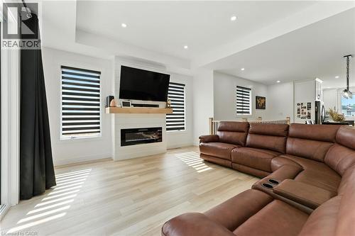 Living area featuring recessed lighting, light wood-style floors, and a fireplace - 9 Macneil Court, Port Burwell, ON - Indoor Photo Showing Living Room With Fireplace