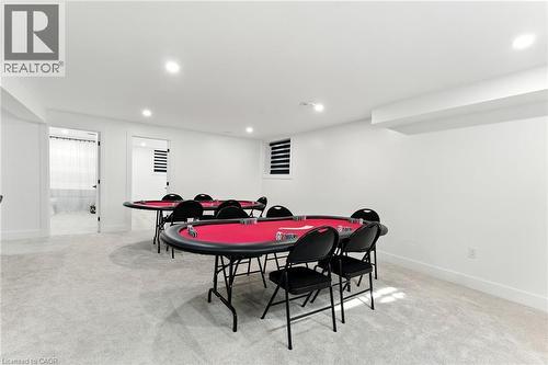 Game room featuring light colored carpet and recessed lighting - 9 Macneil Court, Port Burwell, ON - Indoor