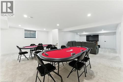 Game room featuring light carpet and recessed lighting - 9 Macneil Court, Port Burwell, ON - Indoor