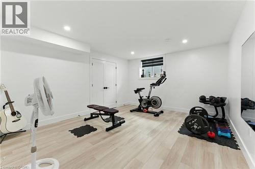 Exercise room featuring light wood-style floors and recessed lighting - 9 Macneil Court, Port Burwell, ON - Indoor Photo Showing Gym Room