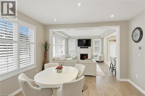 355 Wisteria Way, Oakville, ON - Indoor Photo Showing Dining Room With Fireplace