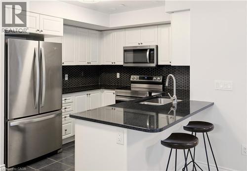 1045 Nadalin Heights Unit# 108, Milton, ON - Indoor Photo Showing Kitchen With Stainless Steel Kitchen