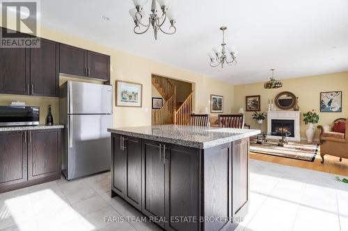 1041 Wickham Road, Innisfil, ON - Indoor Photo Showing Kitchen With Fireplace