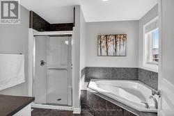 Ensuite bath with separate shower and soaker tub. - 