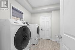 Main floor laundry room with garage access - 