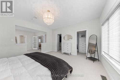 Primary Bedroom wth walk in his & her closets - 25 Philmori Boulevard, Pelham (Fonthill), ON - Indoor Photo Showing Bedroom