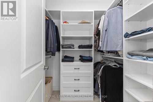 Walk in 'his' closet - 25 Philmori Boulevard, Pelham (Fonthill), ON - Indoor With Storage