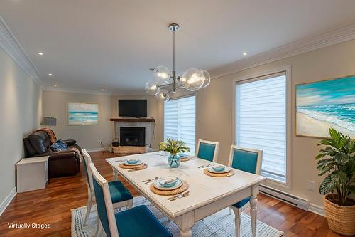 Dining room - 895 Rue Ravel, Brossard, QC - Indoor Photo Showing Dining Room With Fireplace