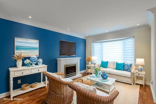 Living room - 895 Rue Ravel, Brossard, QC - Indoor Photo Showing Living Room With Fireplace