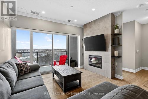 609 - 1878 Gordon Street, Guelph, ON - Indoor Photo Showing Living Room With Fireplace
