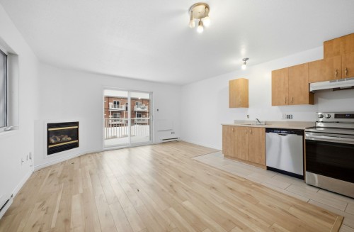 Living Room - 321C Rue Champlain, Gatineau (Hull), QC - Indoor With Fireplace