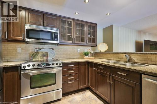 Lower Level Kitchen, Granite Counters - 1658 Covington Terrace, Mississauga, ON - Indoor Photo Showing Kitchen With Double Sink