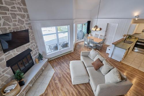 Overall view - F-735 Ch. Des Trois-Villages, Piedmont, QC - Indoor Photo Showing Living Room With Fireplace