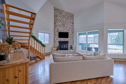 Family room - F-735 Ch. Des Trois-Villages, Piedmont, QC - Indoor Photo Showing Living Room With Fireplace