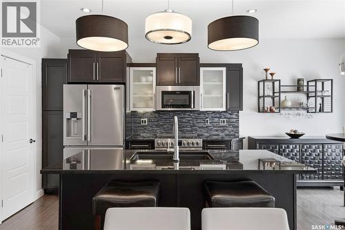 707 Sauer Crescent, Saskatoon, SK - Indoor Photo Showing Kitchen With Stainless Steel Kitchen With Double Sink With Upgraded Kitchen