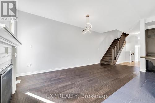 Living room featuring open floor plan - 89 Sonoma Valley Crescent, Hamilton, ON - Indoor With Fireplace