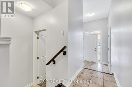 Foyer entrance and Stairs to basement and bathroom - 89 Sonoma Valley Crescent, Hamilton, ON - Indoor Photo Showing Other Room