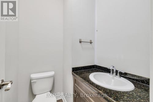 Half bath featuring vanity and toilet - 89 Sonoma Valley Crescent, Hamilton, ON - Indoor Photo Showing Bathroom