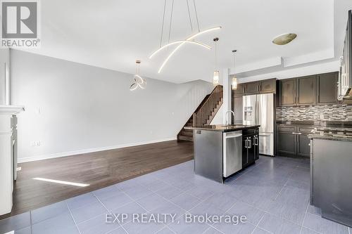 Kitchen  and a center island and livingroom - 89 Sonoma Valley Crescent, Hamilton, ON - Indoor Photo Showing Kitchen With Upgraded Kitchen