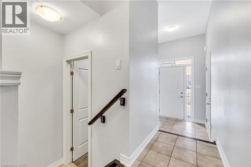 Entrance foyer featuring light tile patterned flooring and baseboards - 89 Sonoma Valley Crescent, Hamilton, ON - Indoor Photo Showing Other Room