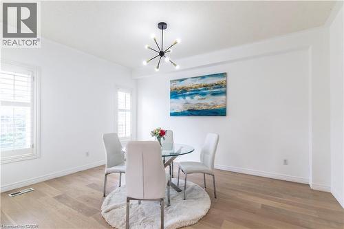 Dining space featuring hanging lights and light wood-style floors - 252 Thorner Drive Unit# Upper, Hamilton, ON - Indoor Photo Showing Dining Room