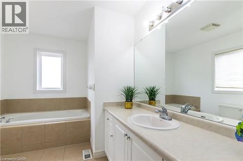 Full bathroom featuring a bath, vanity, and light tile patterned floors - 252 Thorner Drive Unit# Upper, Hamilton, ON - Indoor Photo Showing Bathroom