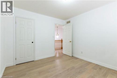 Unfurnished bedroom featuring light wood-style flooring and baseboards - 252 Thorner Drive Unit# Upper, Hamilton, ON - Indoor Photo Showing Other Room