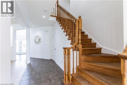 Stairs with recessed lighting, tile patterned floors, and french doors - 252 Thorner Drive Unit# Upper, Hamilton, ON - Indoor Photo Showing Other Room