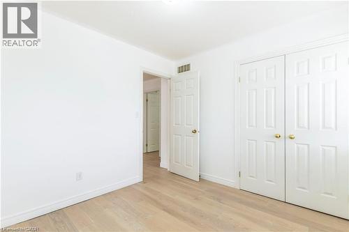 Unfurnished bedroom with light wood-style floors and a closet - 252 Thorner Drive Unit# Upper, Hamilton, ON - Indoor Photo Showing Other Room