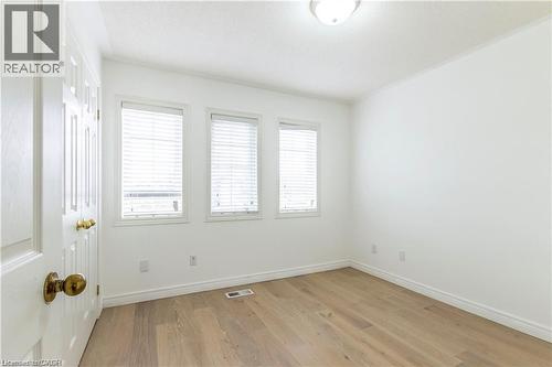 Empty room featuring light wood finished floors and baseboards - 252 Thorner Drive Unit# Upper, Hamilton, ON - Indoor Photo Showing Other Room