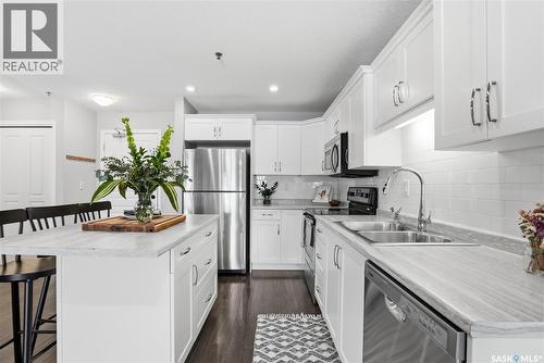 2105 104 Willis Crescent, Saskatoon, SK - Indoor Photo Showing Kitchen With Stainless Steel Kitchen With Double Sink