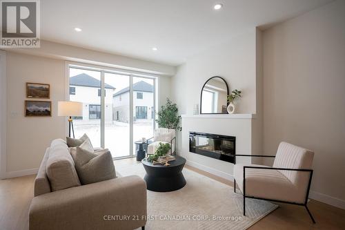 4273 Calhoun Way, London South (South V), ON - Indoor Photo Showing Living Room With Fireplace